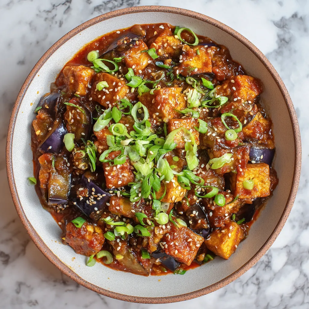 A bowl of food with a lot of green onions.