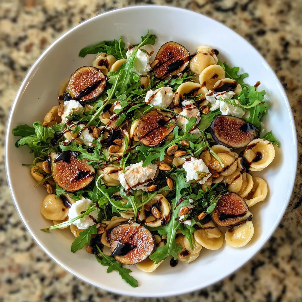 A white bowl of food with a green salad.