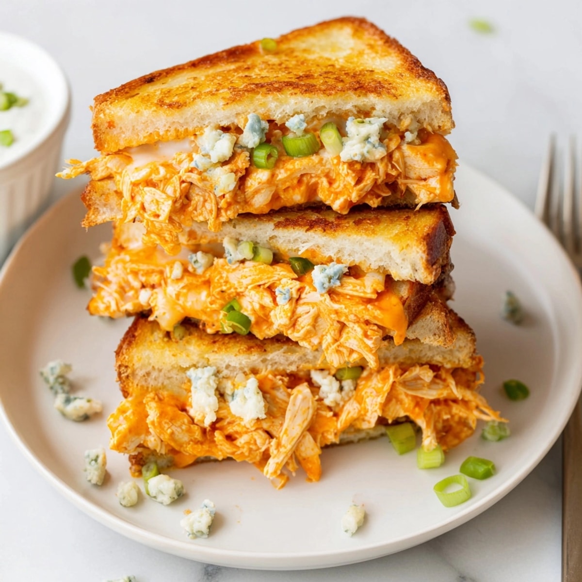 Mouthwatering Buffalo Chicken Grilled Cheese recipe: gooey cheese, tangy sauce, crisp sourdough.