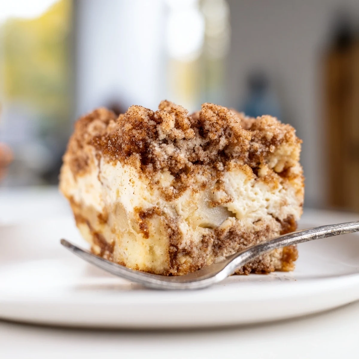 Delicious Ricotta Cinnamon Apple Pie Bars topped with buttery crumb and warm spices.