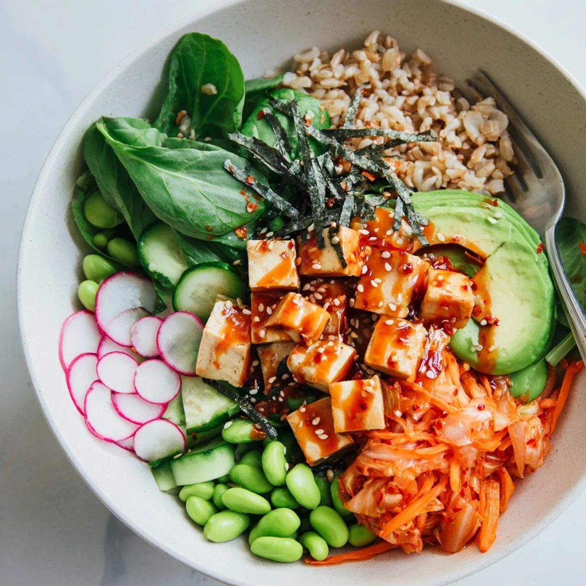 A colorful Fermented Vegetable Bowl topped with spicy kimchi and fresh greens.  