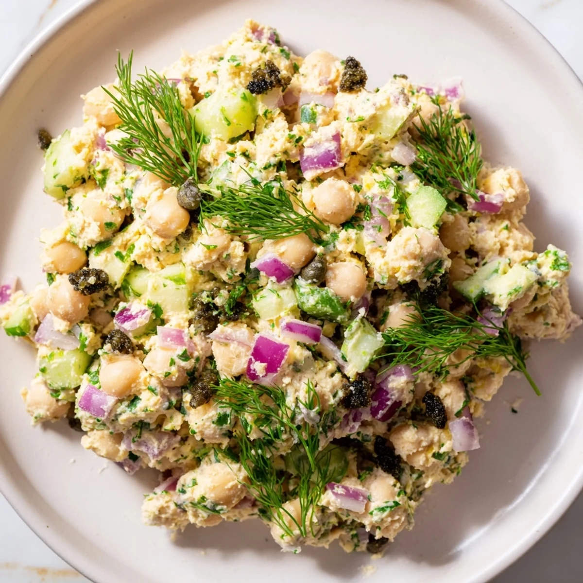 Creamy chickpea tuna salad, a vegan delight ready to be served on a sandwich.