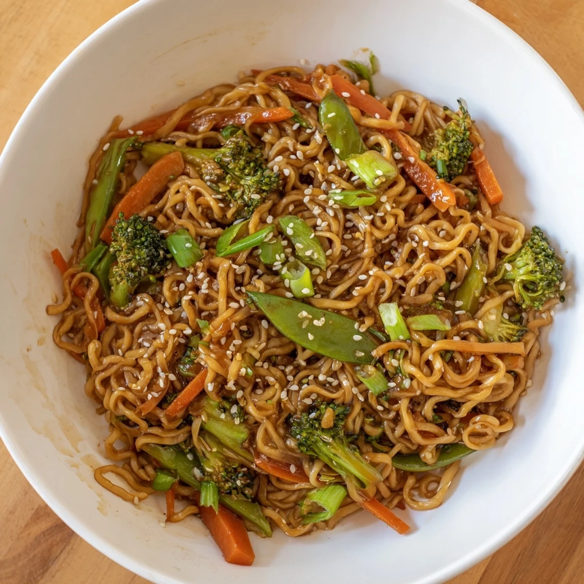 Steaming Ramen Noodle Stir-Fry Remix, loaded with colorful vegetables and glistening sauce for dinner.