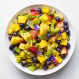 A colorful bowl of Festive Bow Fruit Medley bursts with strawberries, mango, and juicy kiwi, chilled and ready.
