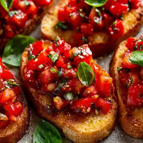 A close up of a tomato basil bruschetta.