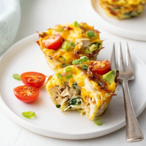 Savory Avocado Ranch Chicken Egg Cups filled with eggs, chicken, and vibrant veggies.