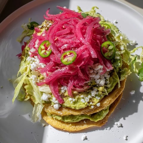 Vibrant 5-minute pickled red onion tacos, bursting with color and delicious crispy avocado crema.