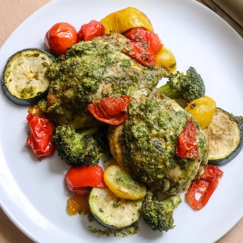 Juicy lemon pesto chicken sheet pan dinner with roasted veggies, smelling aromatic and delicious.