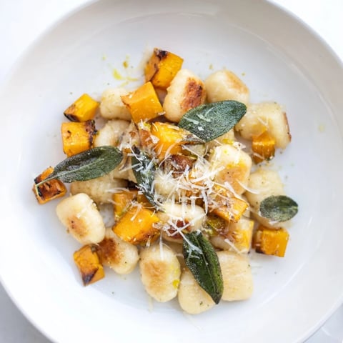 Golden-brown Rustic Butternut Squash & Sage Brown Butter Gnocchi with vibrant, roasted squash pieces throughout.