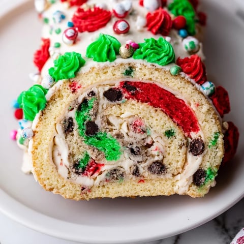 Festive Ugly Sweater Cake Roll with colorful frosting and holiday sprinkles, ready to serve.