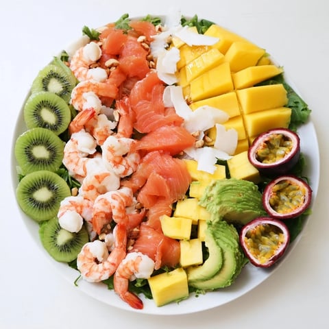 Vibrant Tropical Wave Tasting Platter with grilled shrimp, colorful fruit and creamy avocado, perfect for summer!