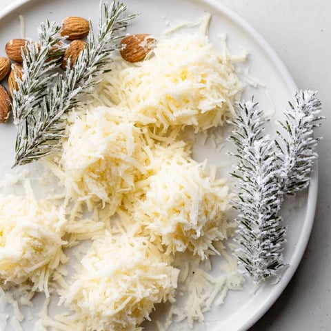 Visually stunning The Frosted Pine cheese board with sugared rosemary as enchanting winter pines.
