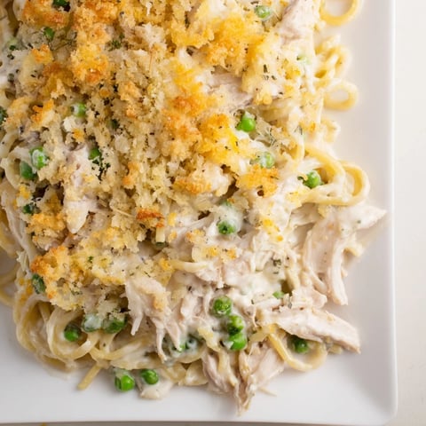 Golden, bubbly Turkey or Chicken Tetrazzini bake topped with parmesan and breadcrumbs, a comforting casserole.
