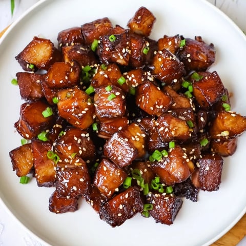 Golden-brown air fryer turkey bites glistening with honey-soy glaze, ready for a festive appetizer spread.