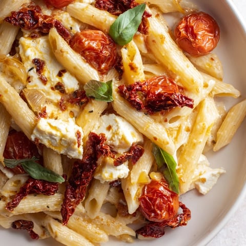 Baked Feta Pasta, a creamy Mediterranean dish with bursting tomatoes and soft feta cheese.