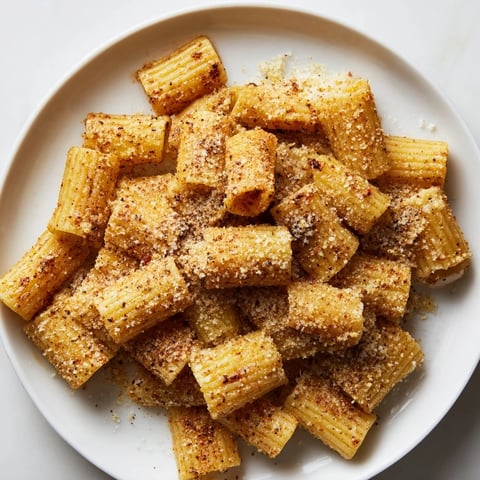 Golden, crispy Parmesan Pasta Chips, perfect for dipping in marinara: a savory, crunchy snack.