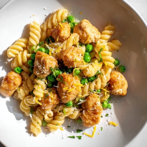 Creamy Garlic Butter Chicken & Pea Pasta, featuring golden chicken and vibrant peas, perfect for dinner.