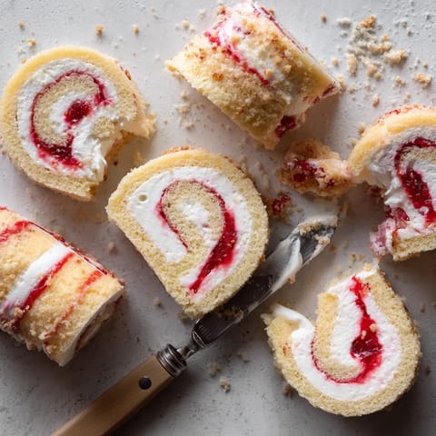 A knife is stuck in a piece of cake.