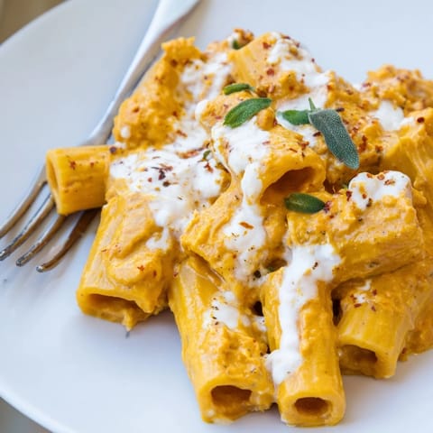 Deliciously smooth Whipped Ricotta Pumpkin Pasta garnished with fresh sage and spices.  