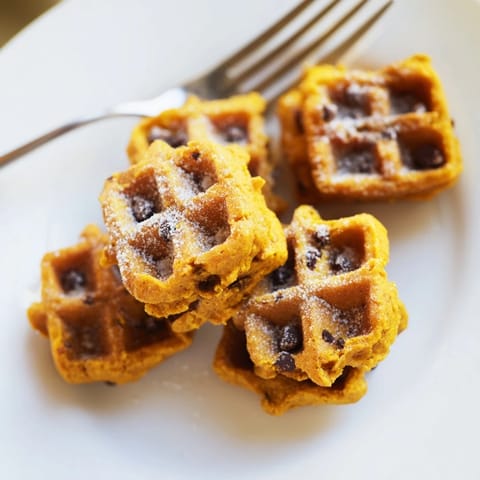 Delicious pumpkin muffin waffle bites, spiced and ready for warm maple syrup drizzle.  