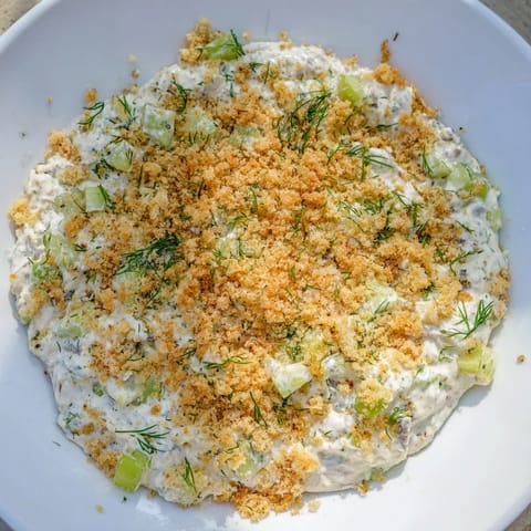 Close-up of Fried Pickle Dip, showcasing the tangy goodness and fresh green onions.