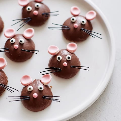 Playful Silly Rat Cake Brownie Bites, these whimsical treats feature cute chocolate rat decorations.