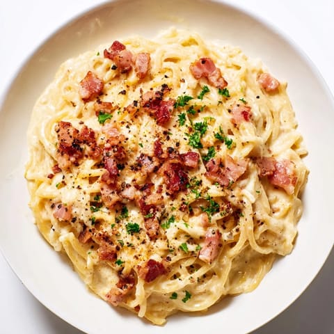 Enjoy a rich bowl of Instant Pot Carbonara Ramen Hack, perfectly blended with hints of garlic and pepper.