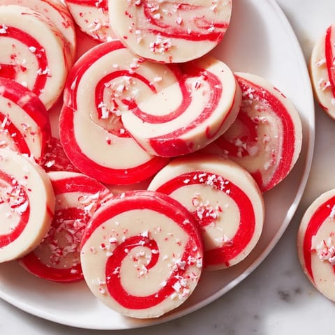 Freshly baked Candy Cane Swirl Cookie Platter showcasing beautifully swirled cookies, ready to be enjoyed with a warm drink.