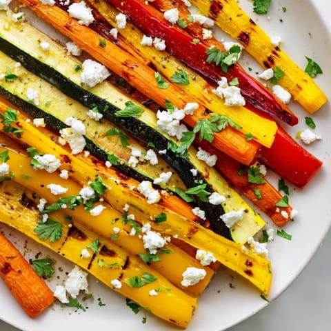 Roasted Christmas Sleigh Veggie Rails: arranged colorful roasted vegetables, ready for serving during holiday feasts.