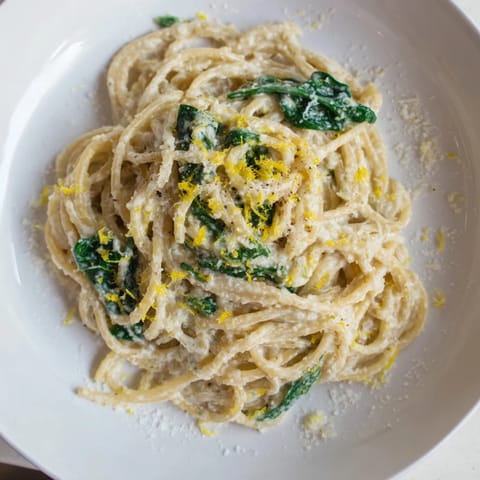 Bright and creamy: this bowl of Creamy Lemon Spinach Spaghetti offers a comforting Italian dinner.
