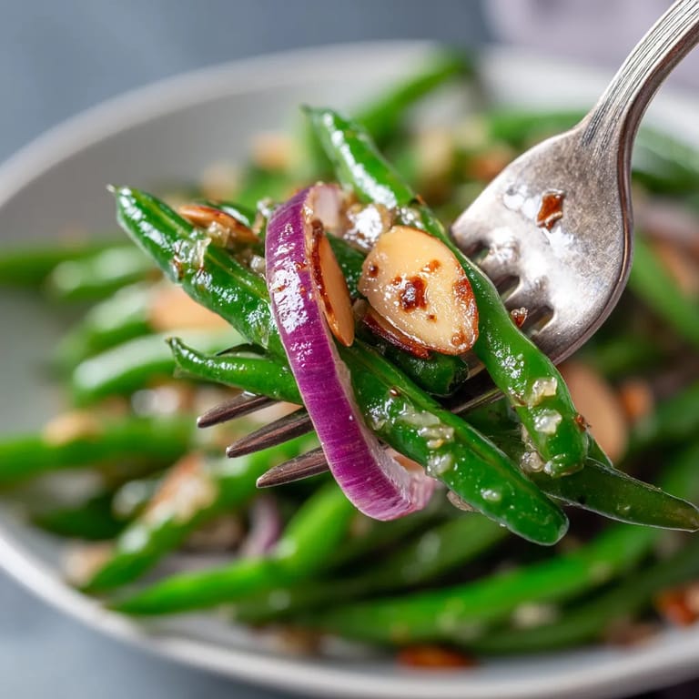 A fork is picking up a piece of food.