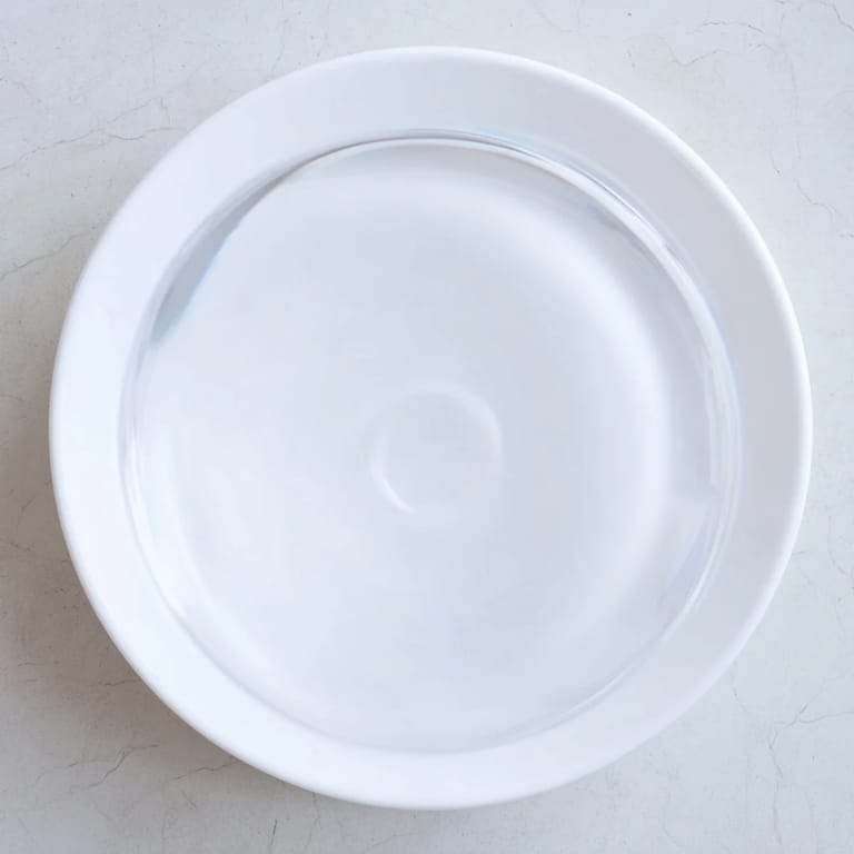 Refreshing water pouring into a tall glass, perfect for accompanying any meal.  