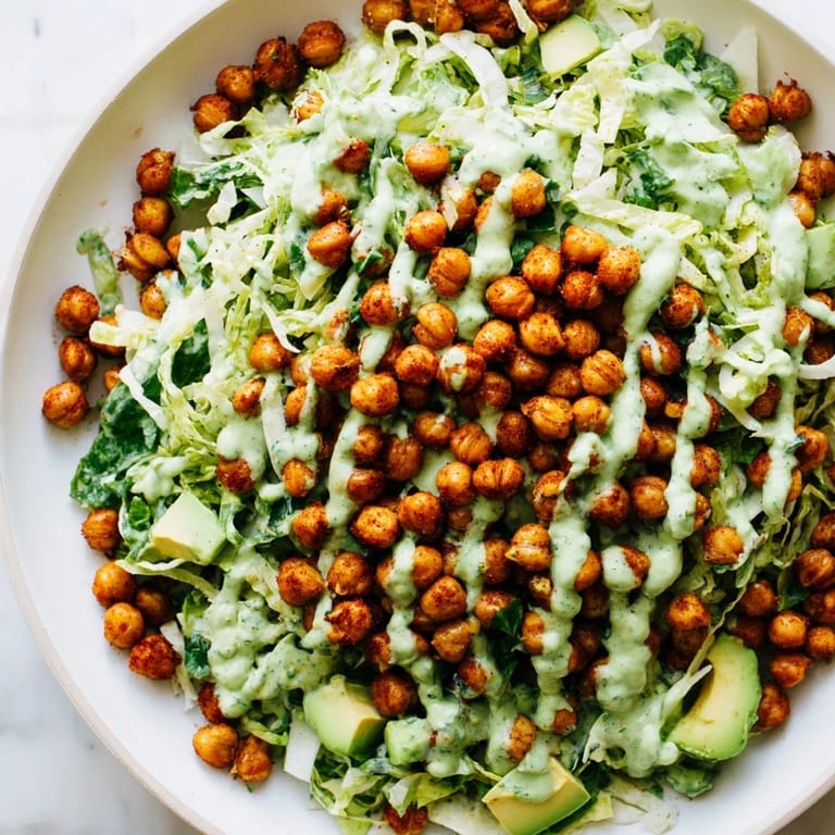 A light and healthy bowl of Green Goddess Salad, starring crispy chickpeas, ready for a refreshing, flavorful meal.