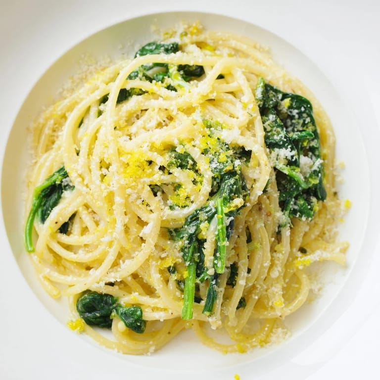 A close-up of delicious Creamy Lemon Spinach Spaghetti, perfectly sauced and ready to be served.