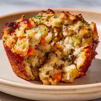 A muffin with carrots and potatoes.